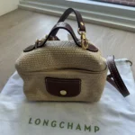 Featured thumbnail for Longchamp Le Pliage Straw Crossbody Bag