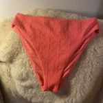 Featured thumbnail for Neon orange leotard bottoms