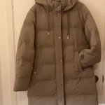 Featured thumbnail for Light beige mid-length coat