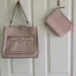 Featured thumbnail for Pink Steve Madden handbag with a clutch bag, shoulder strap AND short strap.