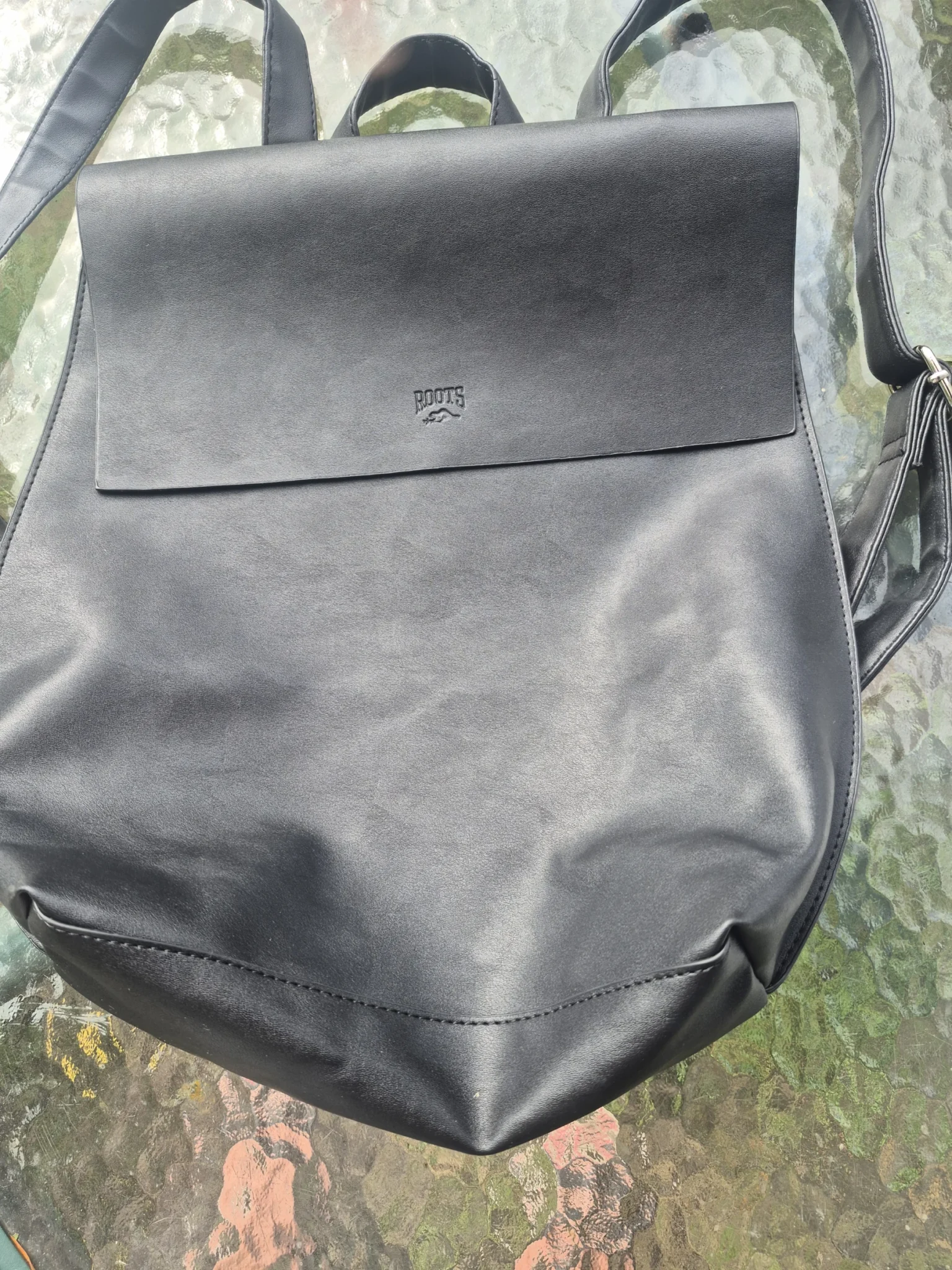 Featured image for Roots black leather rucksack bag