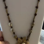 Featured thumbnail for Collier Artisanal Vintage Perles de Bois et Gousses de Graines Naturelles Fleur Boho Ethnique