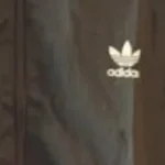 Thumbnail for Black hooded windbreaker from Adidas Originals featuring the classic trefoil logo on the chest