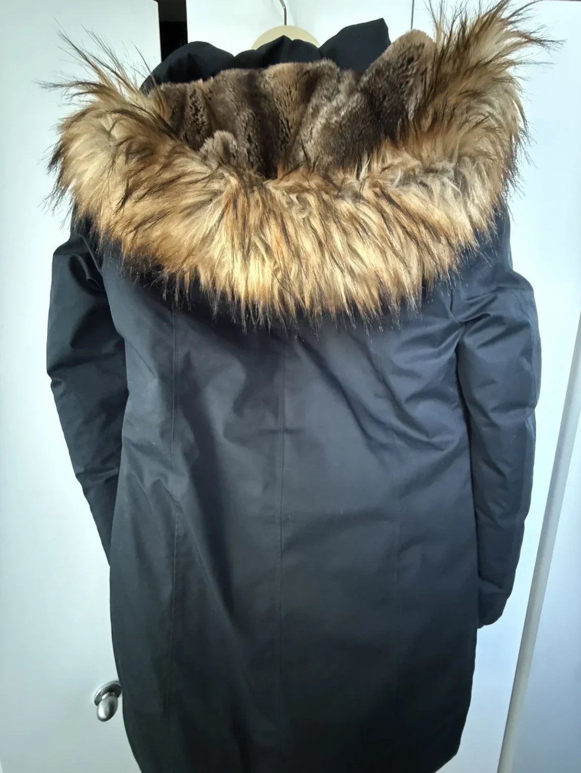 Image for navy blue coat with a fur-trimmed hood