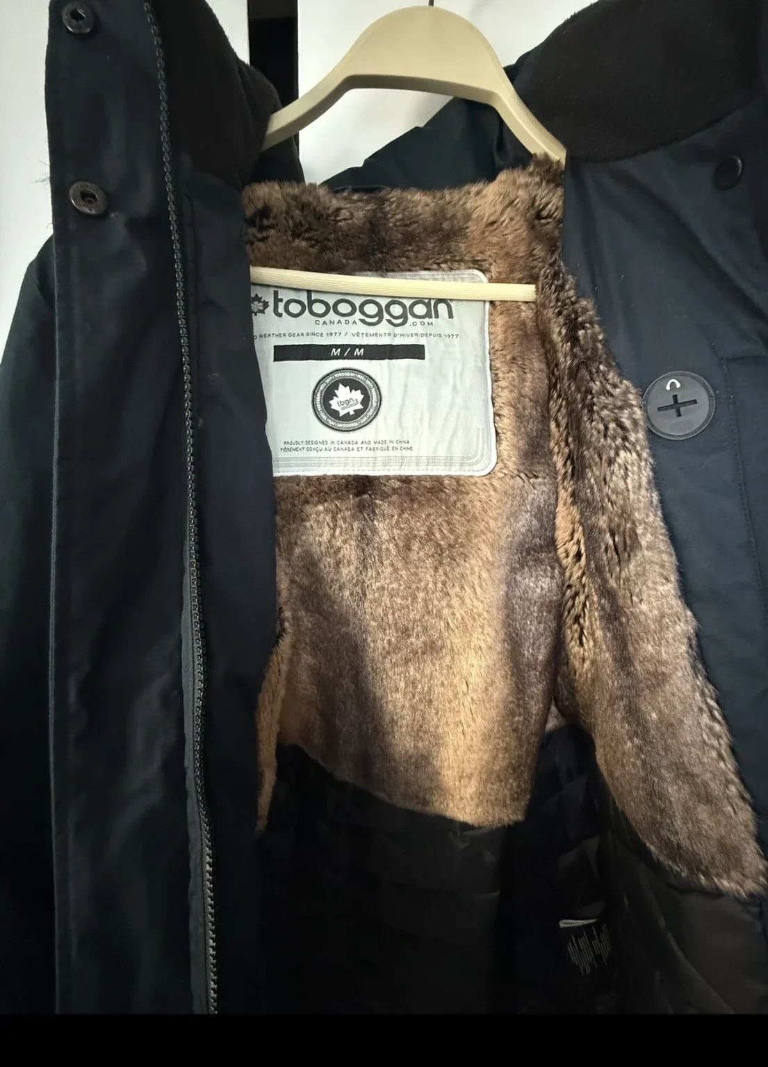 Image for navy blue coat with a fur-trimmed hood