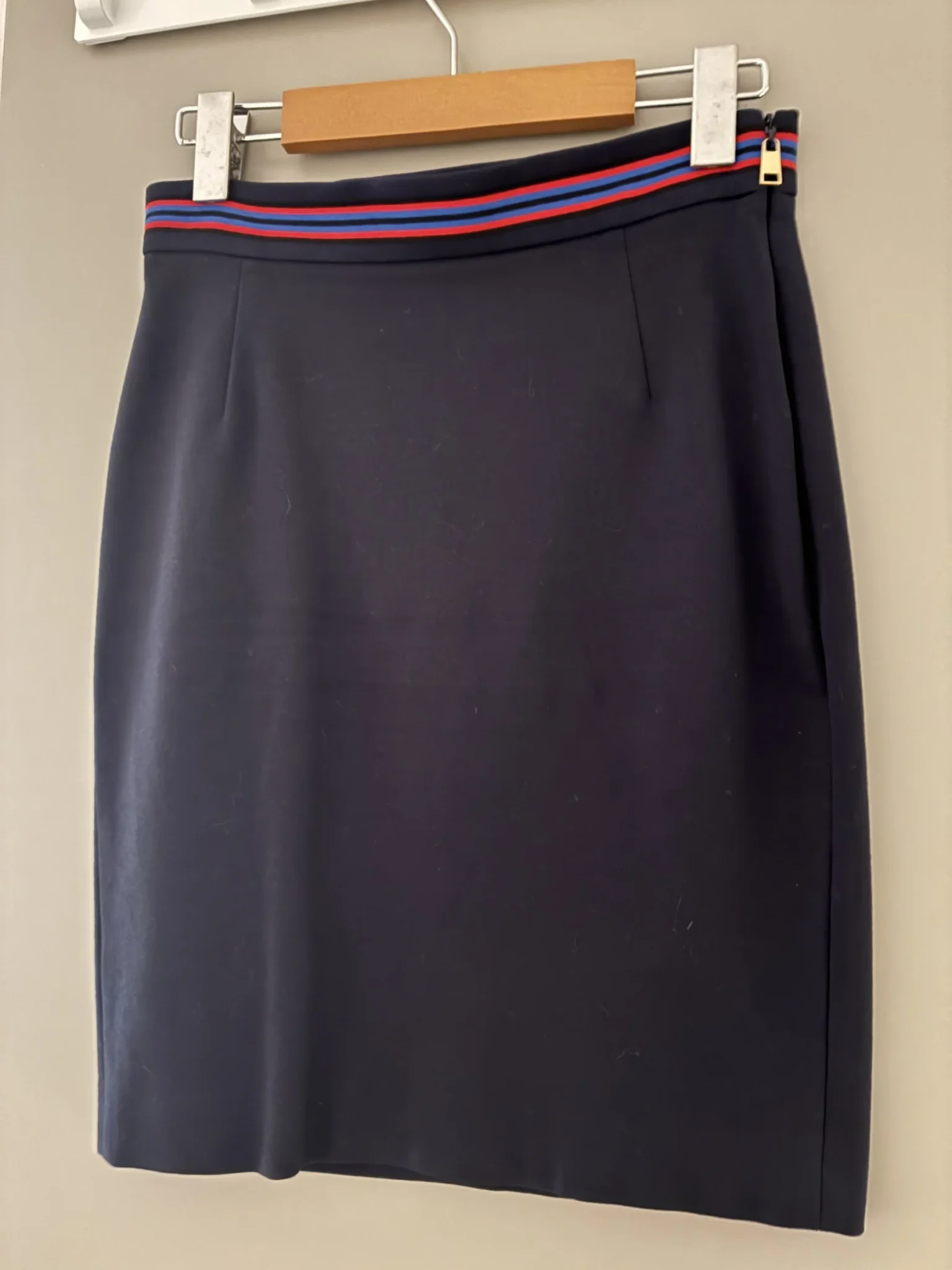 Featured image for Flattering navy Escada skirt that accentuates the waist