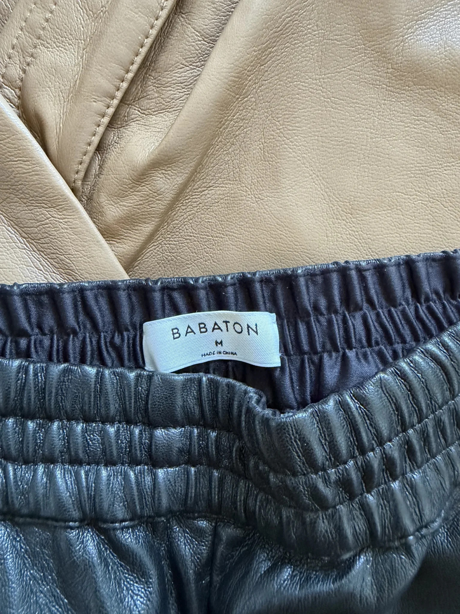 Image for Babaton trousers, size M, black faux leather, jogger-style