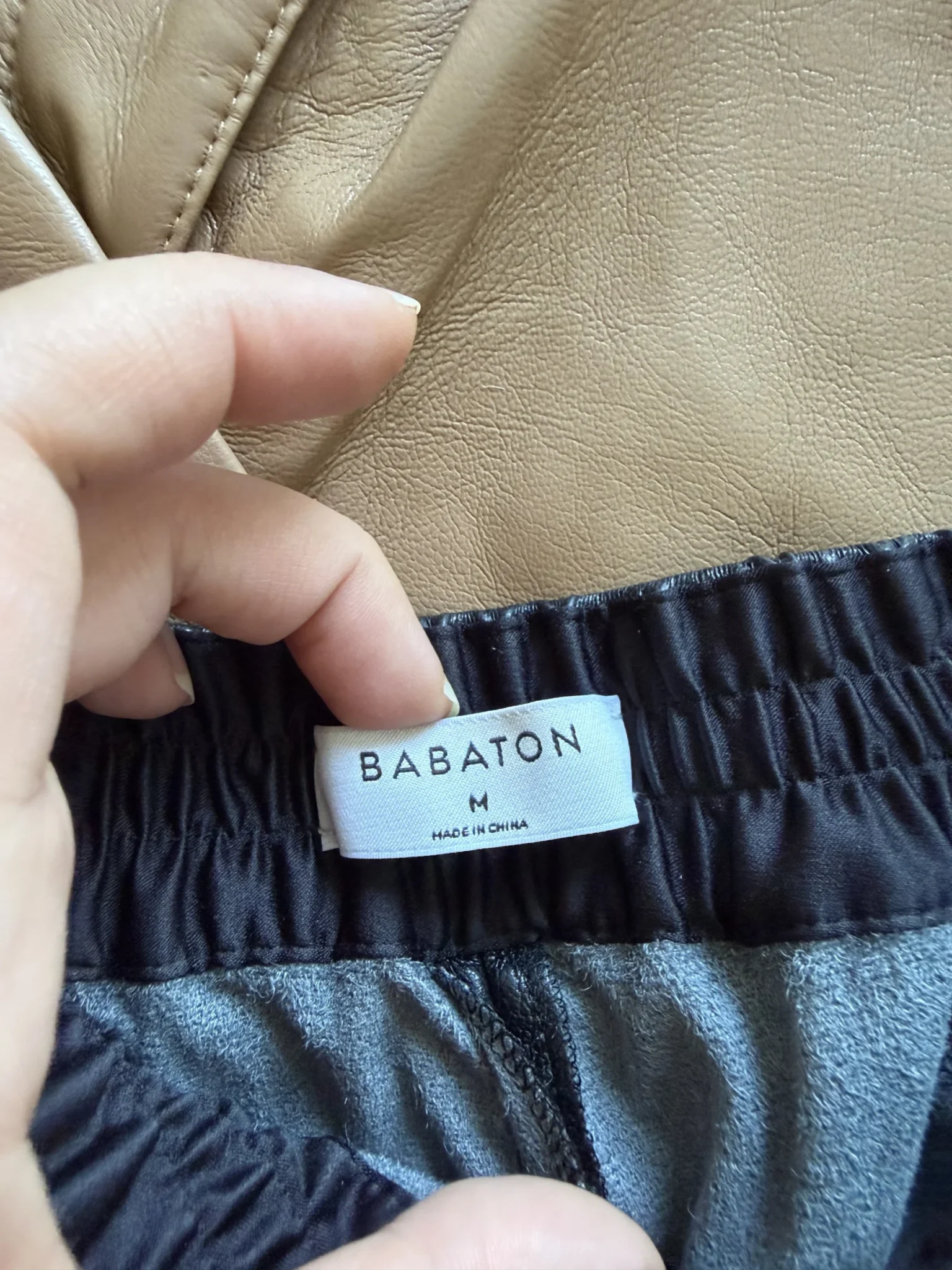 Image for Babaton trousers, size M, black faux leather, jogger-style