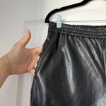 Thumbnail for Babaton trousers, size M, black faux leather, jogger-style