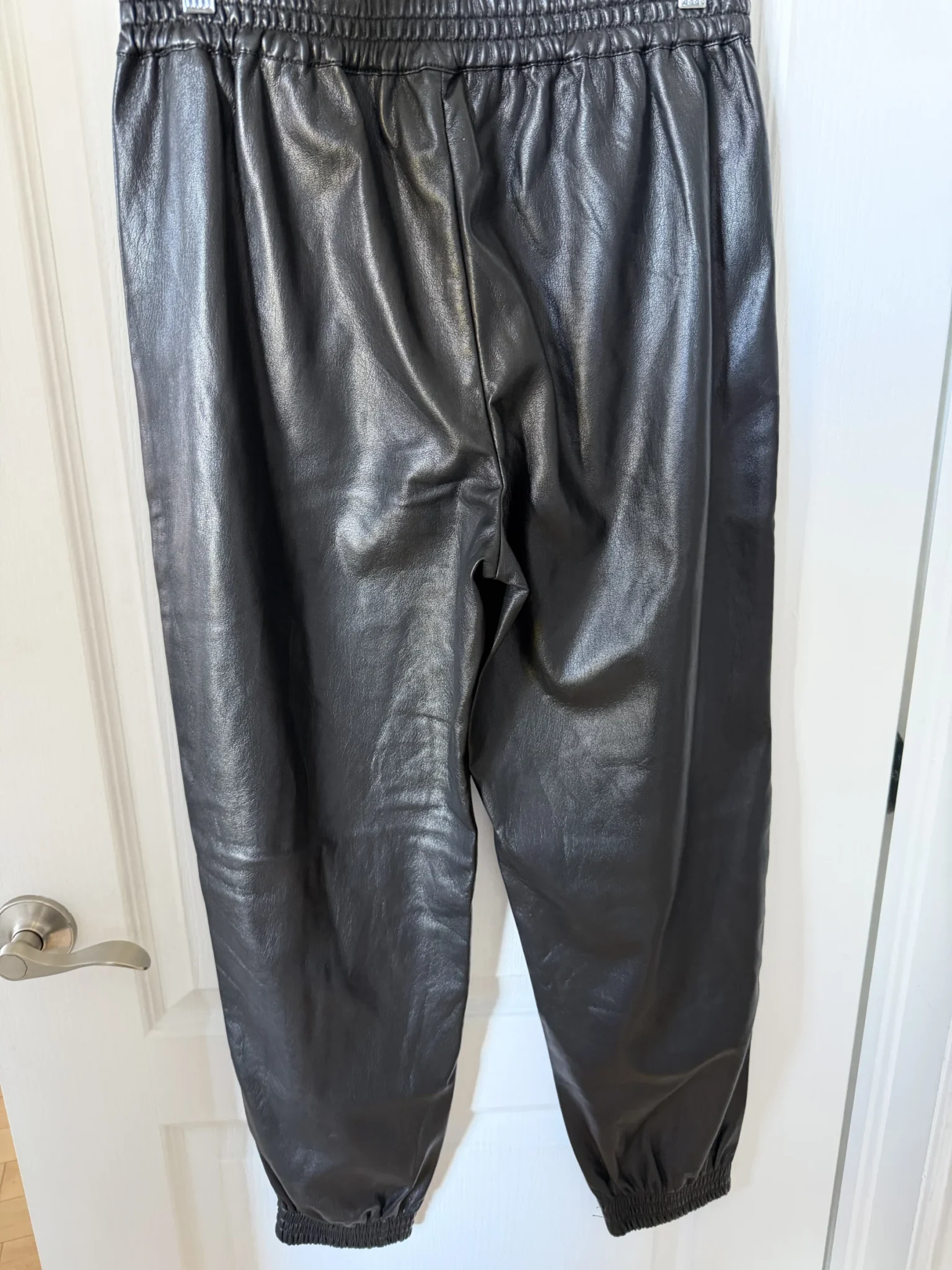 Image for Babaton trousers, size M, black faux leather, jogger-style