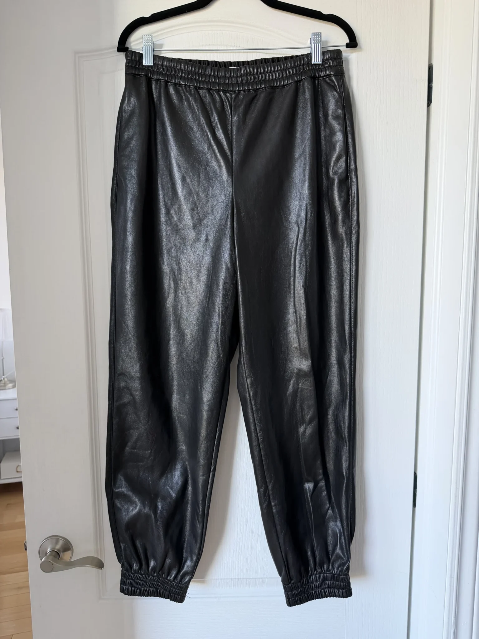 Image for Babaton trousers, size M, black faux leather, jogger-style