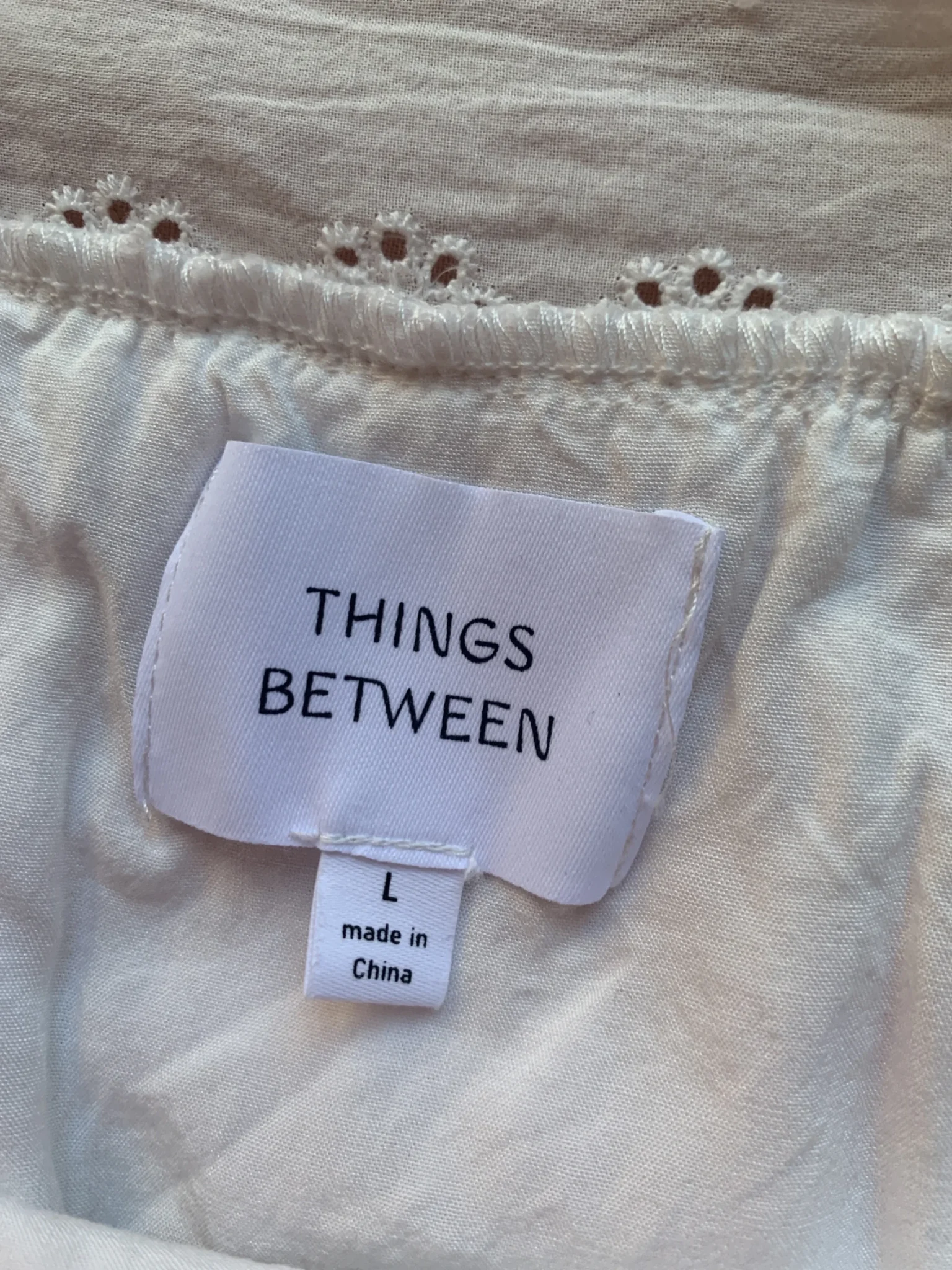 Image for THINGS BETWEEN – A flirty white babydoll dress with openwork lace and scalloped trim – G