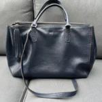 Featured thumbnail for Anya Hindmarch handbag in navy blue leather