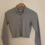 Featured thumbnail for Sunday Best long-sleeved cropped zip-up top