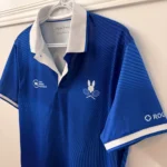 Thumbnail for Official Omnium Banque Nationale 2026 Psycho Bunny polo shirt