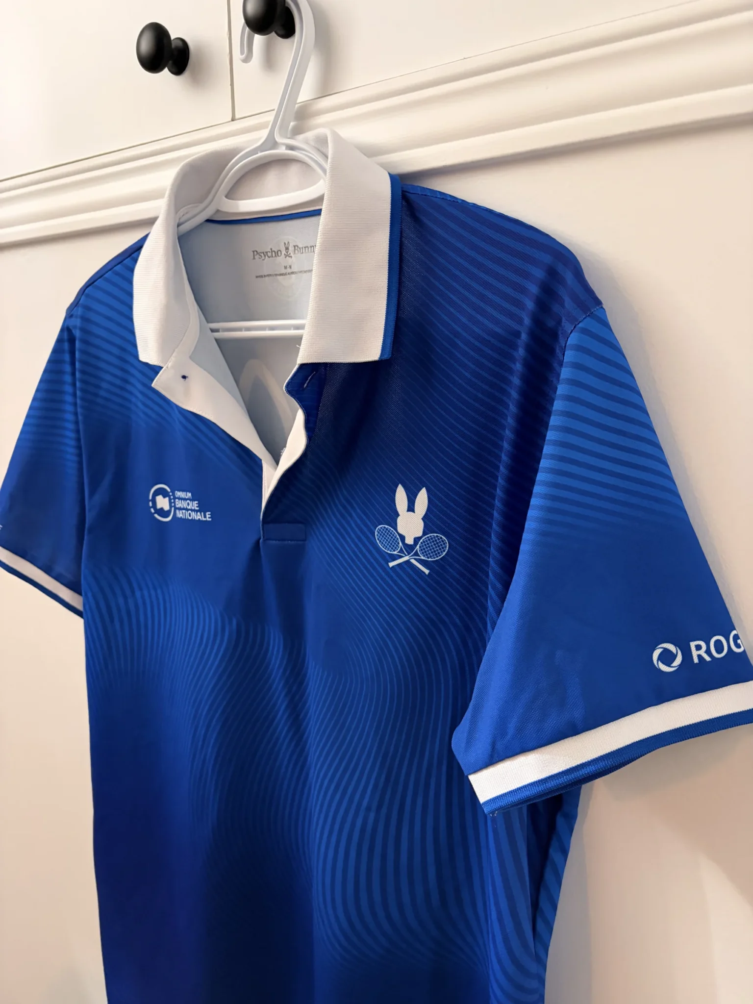 Image for Official Omnium Banque Nationale 2026 Psycho Bunny polo shirt
