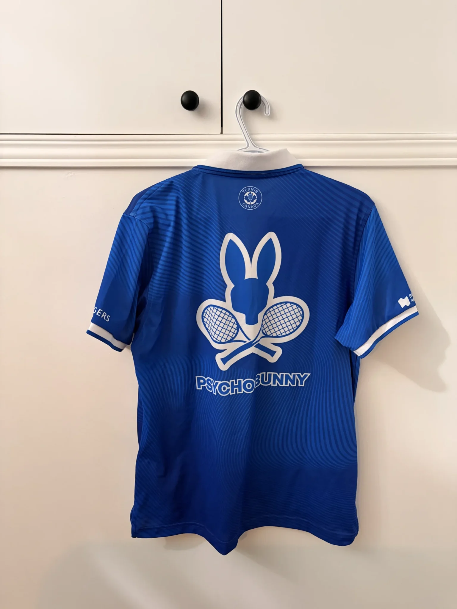 Image for Official Omnium Banque Nationale 2026 Psycho Bunny polo shirt