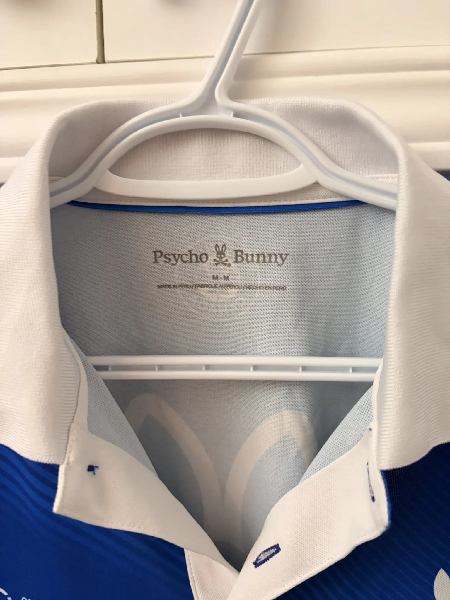 Image for Official Omnium Banque Nationale 2026 Psycho Bunny polo shirt