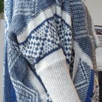 Featured thumbnail for Blue and beige braided poncho