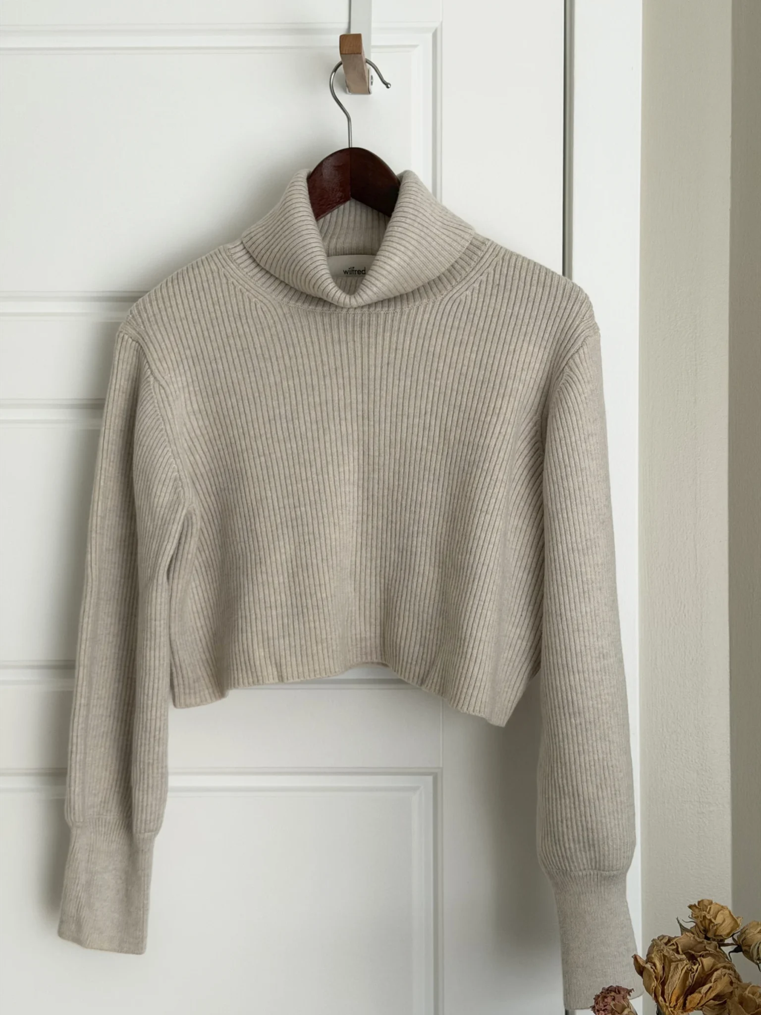 Featured image for Merino wool roll-neck jumper with a V-neck
