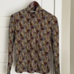 Featured thumbnail for Frank and Oak fitted top with a high neck and floral print