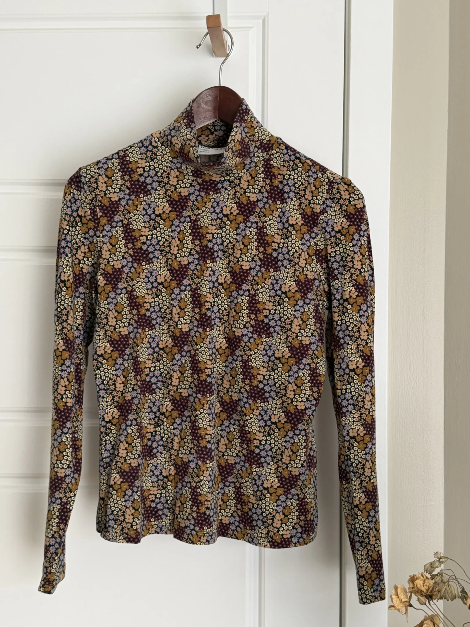 Featured image for Frank and Oak fitted top with a high neck and floral print
