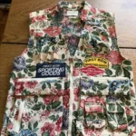 Featured thumbnail for Floral, tapestry-style sleeveless utility jacket