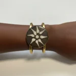 Featured thumbnail for Gold Bangle with Sun Medallion