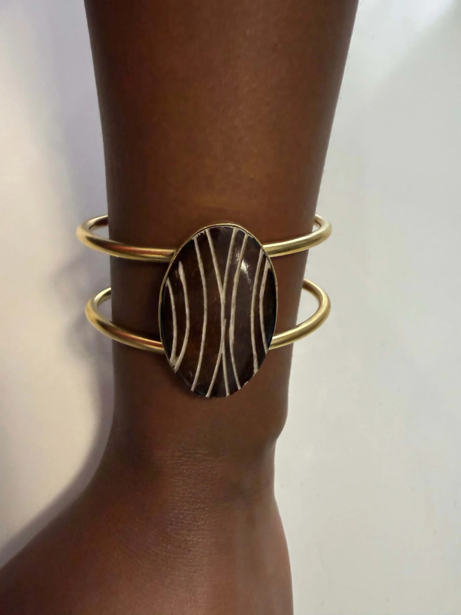 Featured image for Gold Bangle Bracelet with Cabochon and Geometric Lines