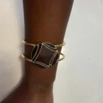 Featured thumbnail for Gold Bangle with Round Cabochon and Geometric Design