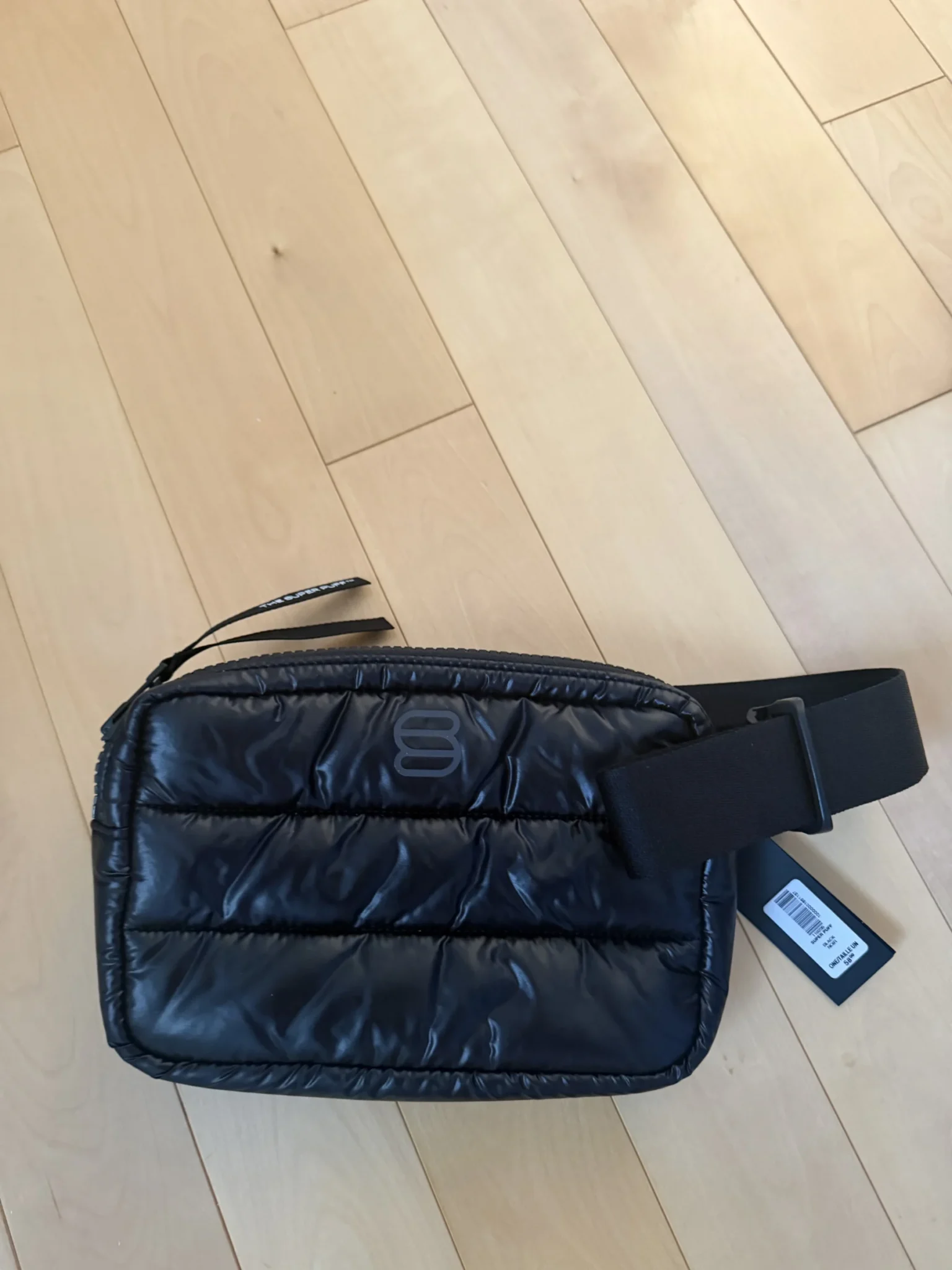 Featured image for Brand-new black Super Puff clutch bag