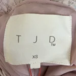 Thumbnail for The Jetset Diaries - Robe courte XS en nude - Jamais porté