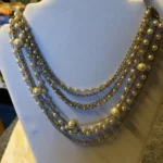 Featured thumbnail for Collier Vintage Cascade Multi-rangs Signé CORO - Années 1950/60