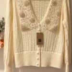 Featured thumbnail for Soolinen | Cream-coloured openwork knitted cardigan with pearls