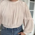 Featured thumbnail for Blouse Joie taille L manches bouffantes rose pale