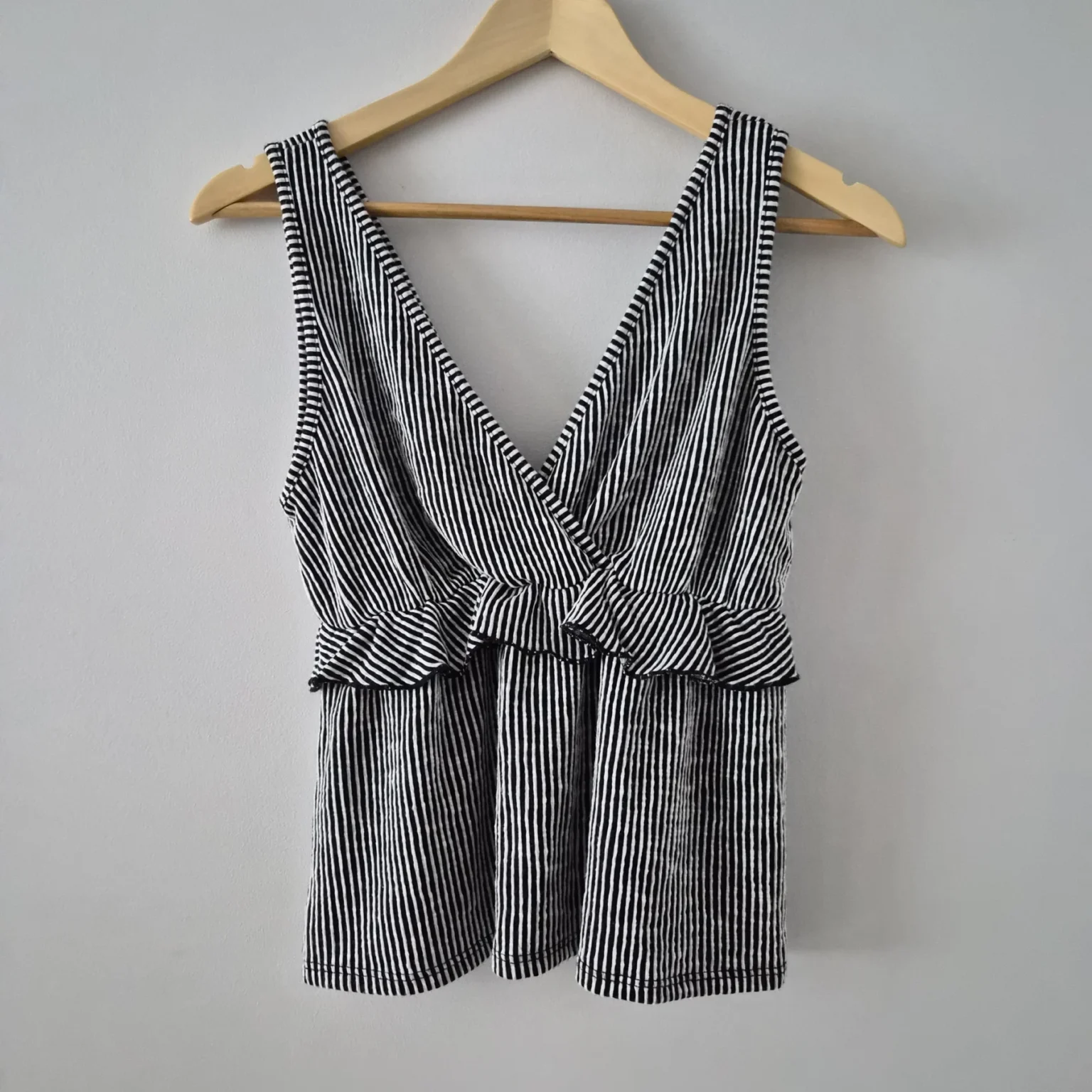 Featured image for Striped, ruffled, wrap-around sleeveless top