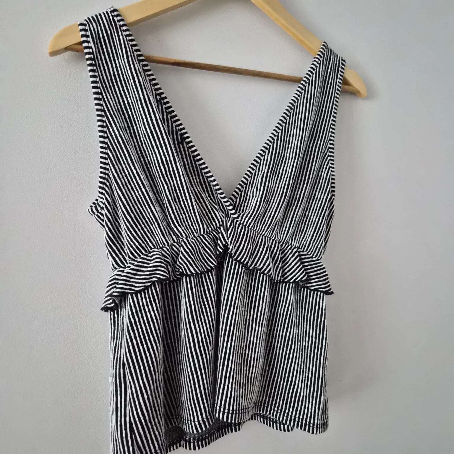 Image for Striped, ruffled, wrap-around sleeveless top