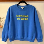 Featured thumbnail for Chandail molletonné bleu à message brodé – Taille L/G