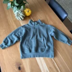 Featured thumbnail for Green half-zip jumper