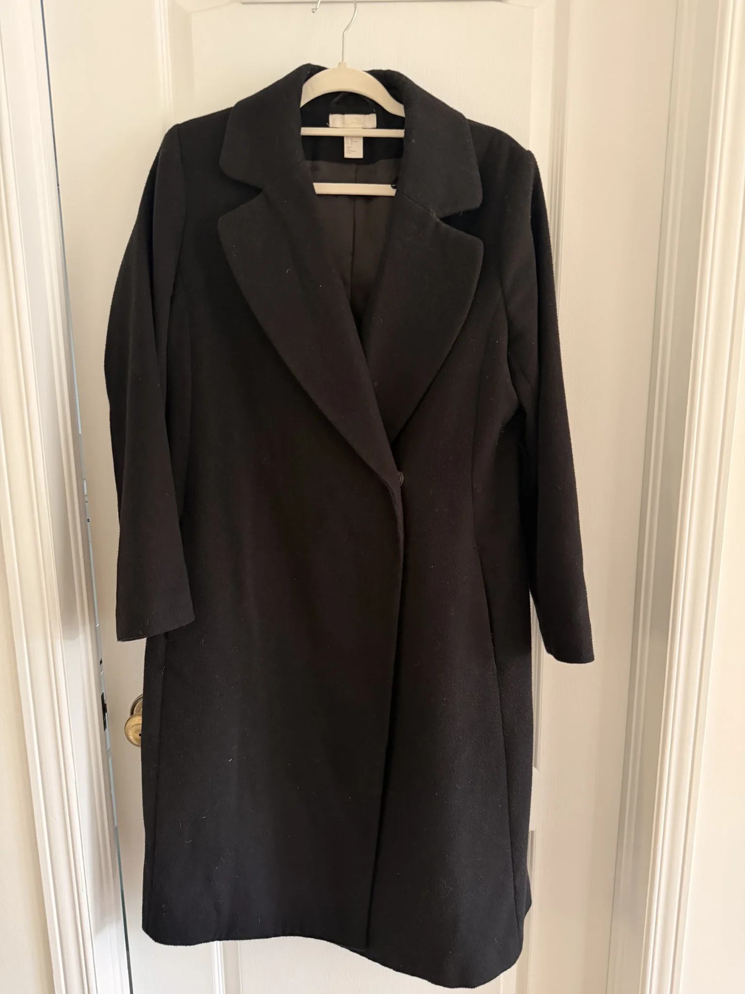 Featured image for Women’s long black coat