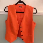 Featured thumbnail for Sleeveless orange blazer