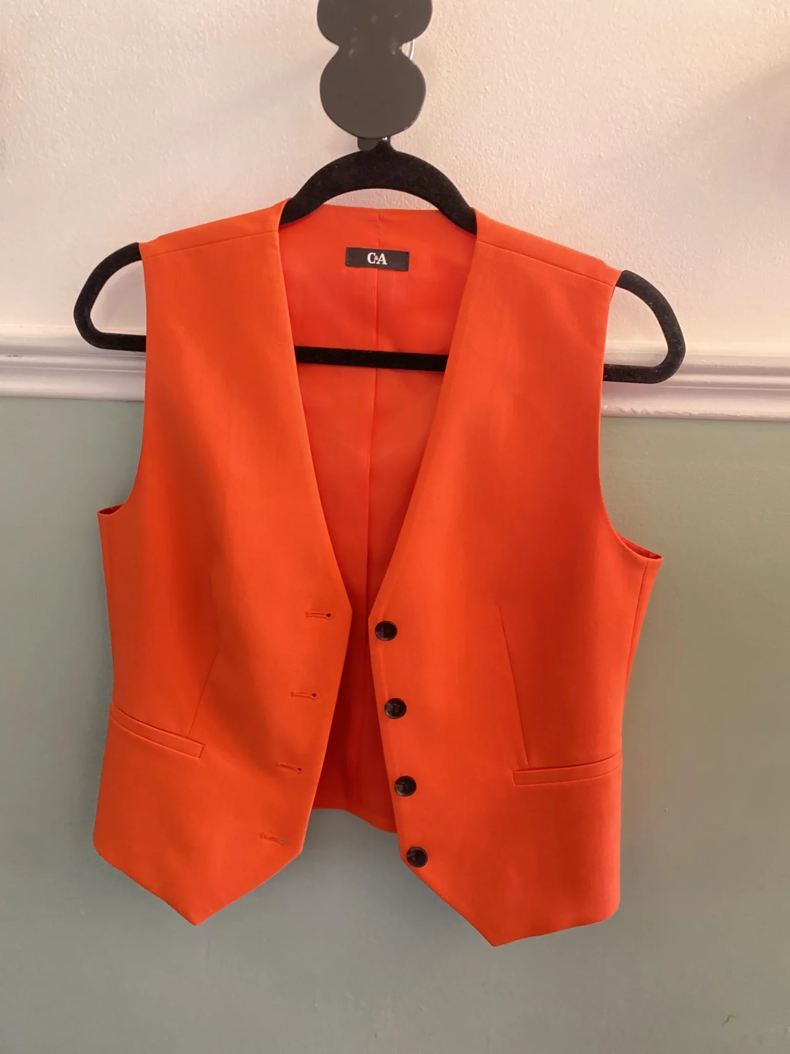 Featured image for Sleeveless orange blazer