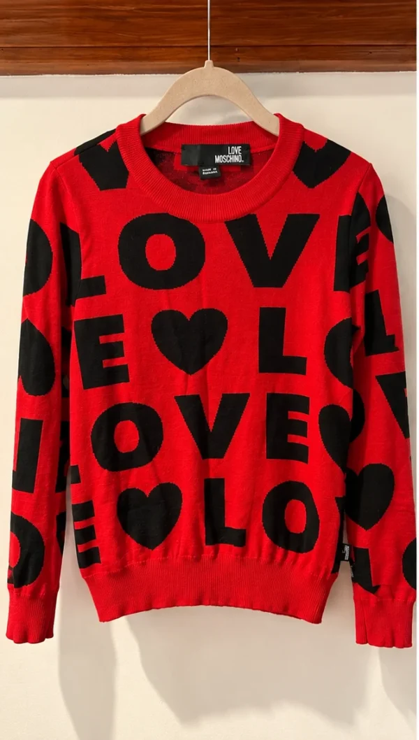 Featured image for Red and black Love Moschino jumper – Featuring a ‘LOVE’ print and hearts