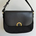 Featured thumbnail for Sac à main Caroll noir à détail doré