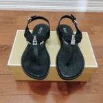Featured thumbnail for Michael Kors Black Quilted T-Strap Sandals with Silver Hardware