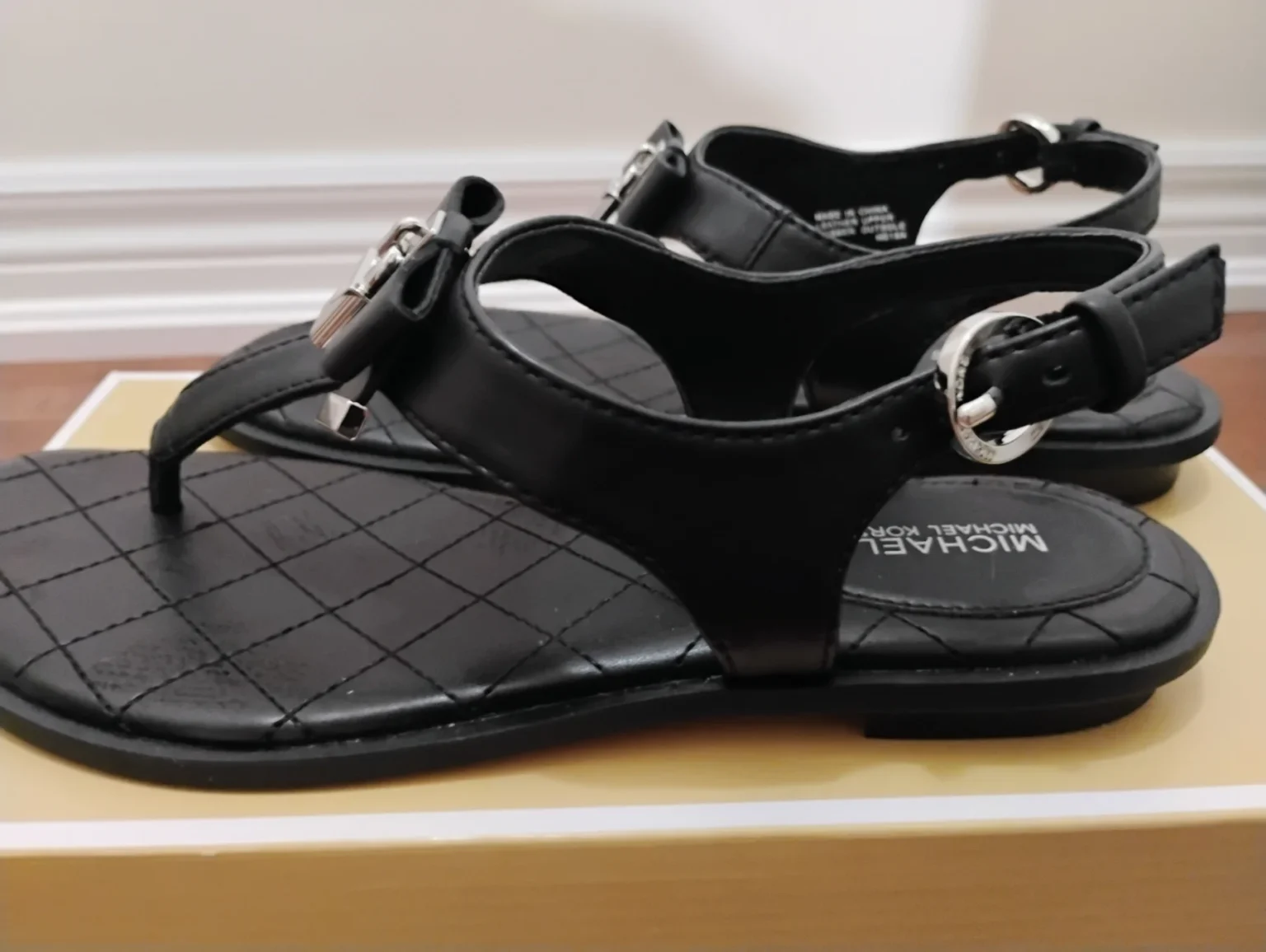 Image for Michael Kors Black Quilted T-Strap Sandals with Silver Hardware