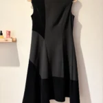 Featured thumbnail for Black DKNY dress – A mix of textures and an asymmetrical cut – Size 6