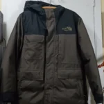 Featured thumbnail for The North Face hooded winter coat – Black and dark grey, camouflage lining, integrated balaclava.
