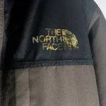 Thumbnail for The North Face hooded winter coat – Black and dark grey, camouflage lining, integrated balaclava.