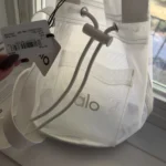 Featured thumbnail for Alo Yoga - petit sac / Sheer Cross Body Bucket Bag